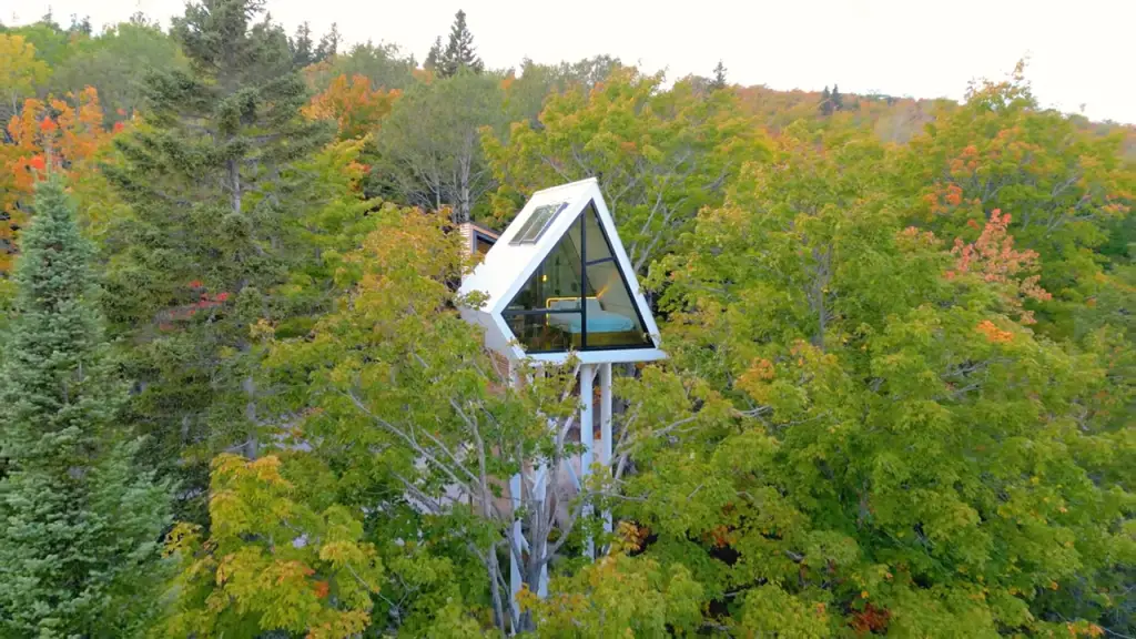 The kitchen, living room, and dining area are thoughtfully laid out, providing a cozy yet stylish environment.